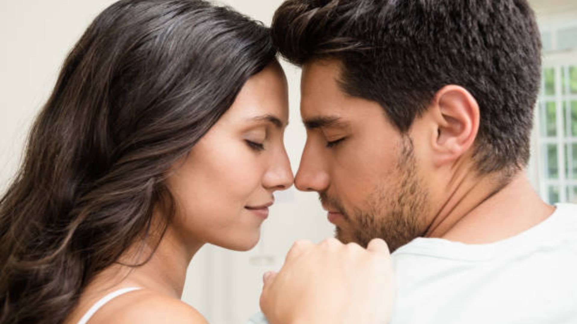 A couple engaged in a deep conversation about emotional depth and conscious romance.